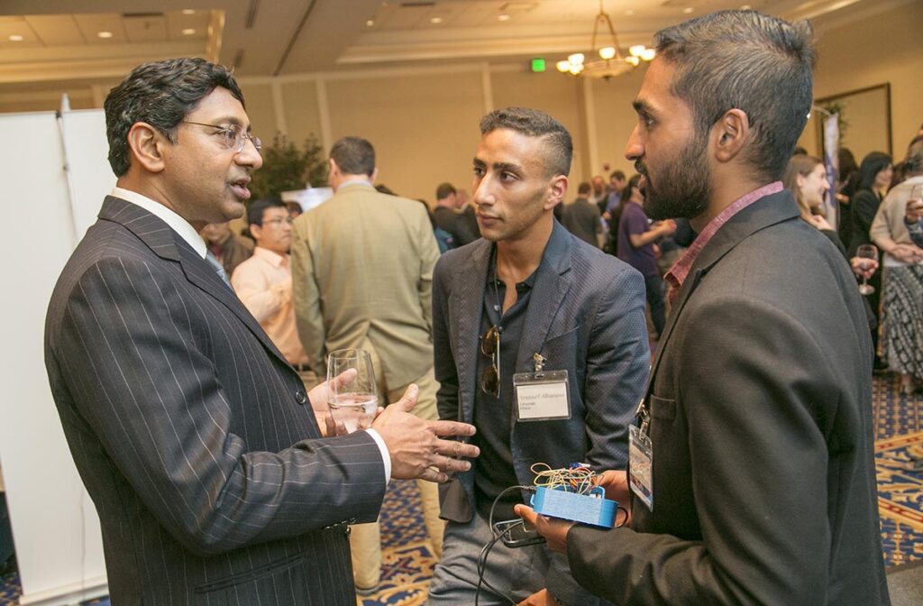 At our 1st Annual Invented at Duke Celebration, Professor Ravi Bellamkonda, Dean of the Pratt School of Engineering, chats with a Duke Alumni and a member of the local community about inventions, innovation, and entrepreneurship. Photo by Jared Lazarus/Duke Photography