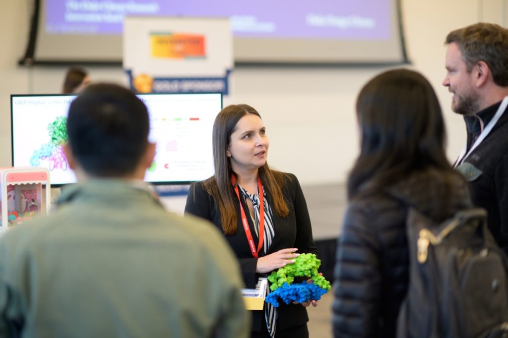 Victoria Goldenshtein explains the GRIP Display tech to attendees. Credit: Brian Mullins Photography.